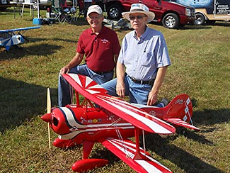 George Bassett on the left and Bob Bailey on the right with George's Pitts that Bob built in 1976. Bob flew the plane a few times and then sold it to Cliff Bennett of B&B Specialties.  Cliff had a bad cross wind crash and George bought the plane from Cliff and put it back in flying condition.  It was great to get Bob and the Pitts back together after all these years.